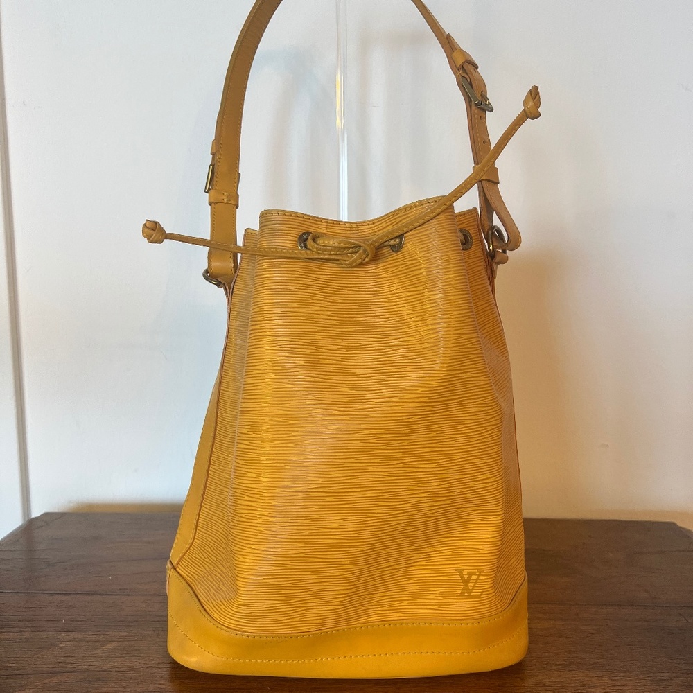 Authentic Louis Vuitton Yellow Epi Leather Noe GM bag with matching wallet